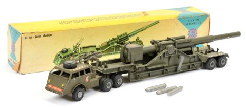 FJ Articulated rocket launcher - drab green with large gun and small guns on cab back, with some ...