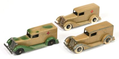 Tootsietoy group of 3 "Ambulances - (1) Camouflage green/tan, (2) tan with red crosses