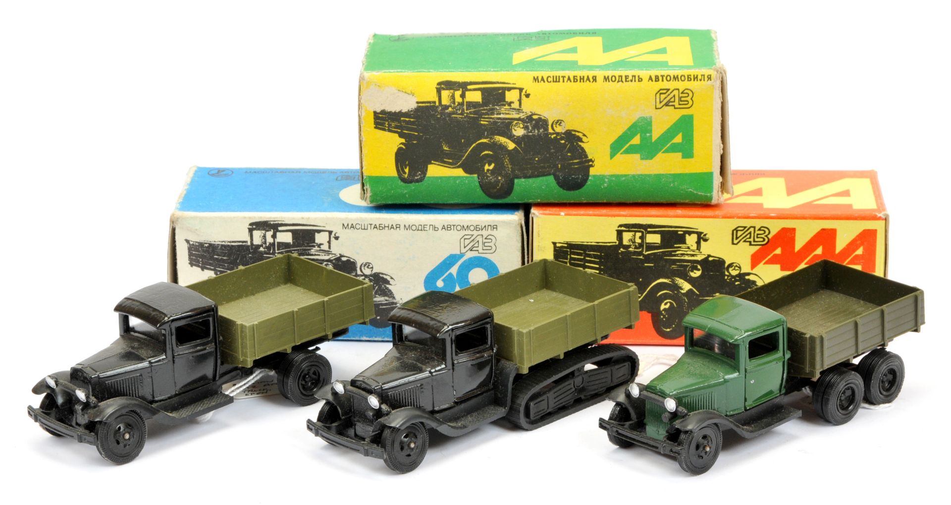 Russain made group 3  of military (1/43rd) scale open back trucks -(1) green cab with military gr...