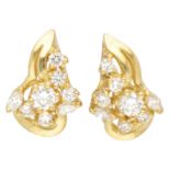 18K. Yellow gold handmade ear studs set with brilliant and marquis cut diamond.
