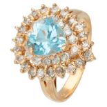 14K. Yellow gold entourage ring set with approx. 2.30 ct. 'sky blue' topaz and approx. 0.35 ct. diam