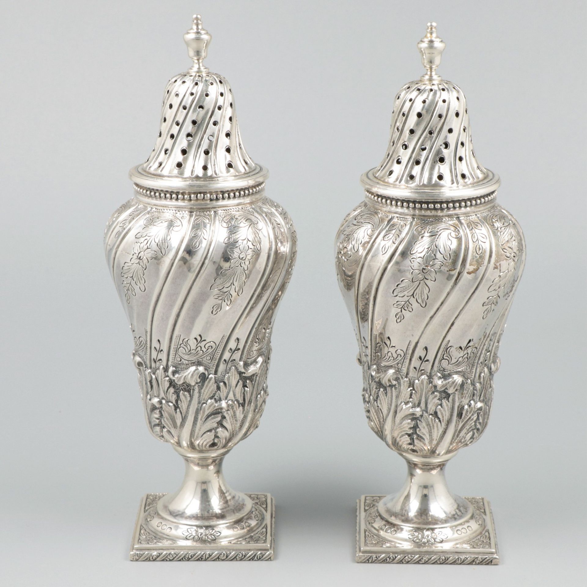 2-piece set of silver casters.