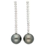 18K. White gold hand made dangling earrings set with Tahiti pearls and approx. 0.56 ct. diamond.