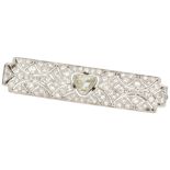 Pt 800 platinum Art Deco bar brooch centrally set with a light yellow diamond.