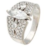 18K. White gold ring set with a marquise cut diamond.