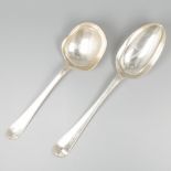 2-piece lot of serving spoons silver.
