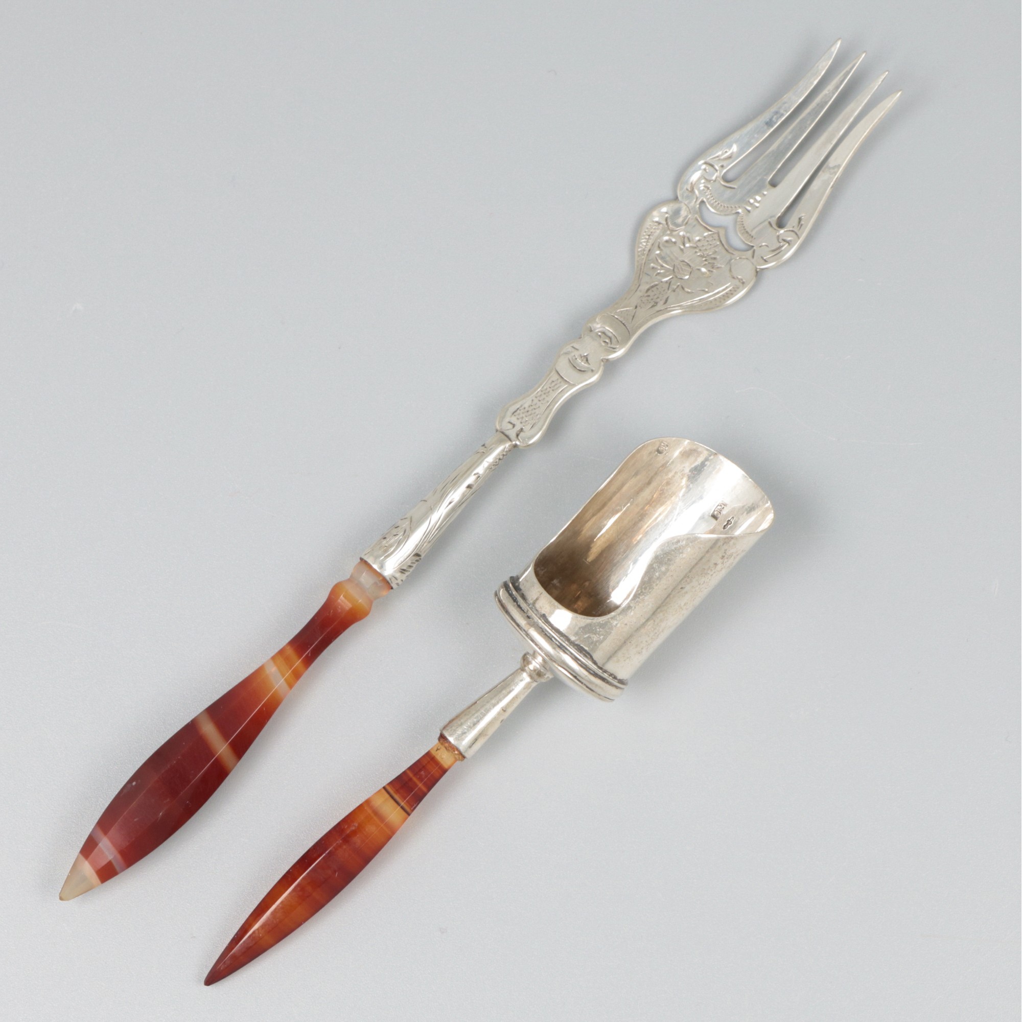 Sugar scoop & pickles fork silver.