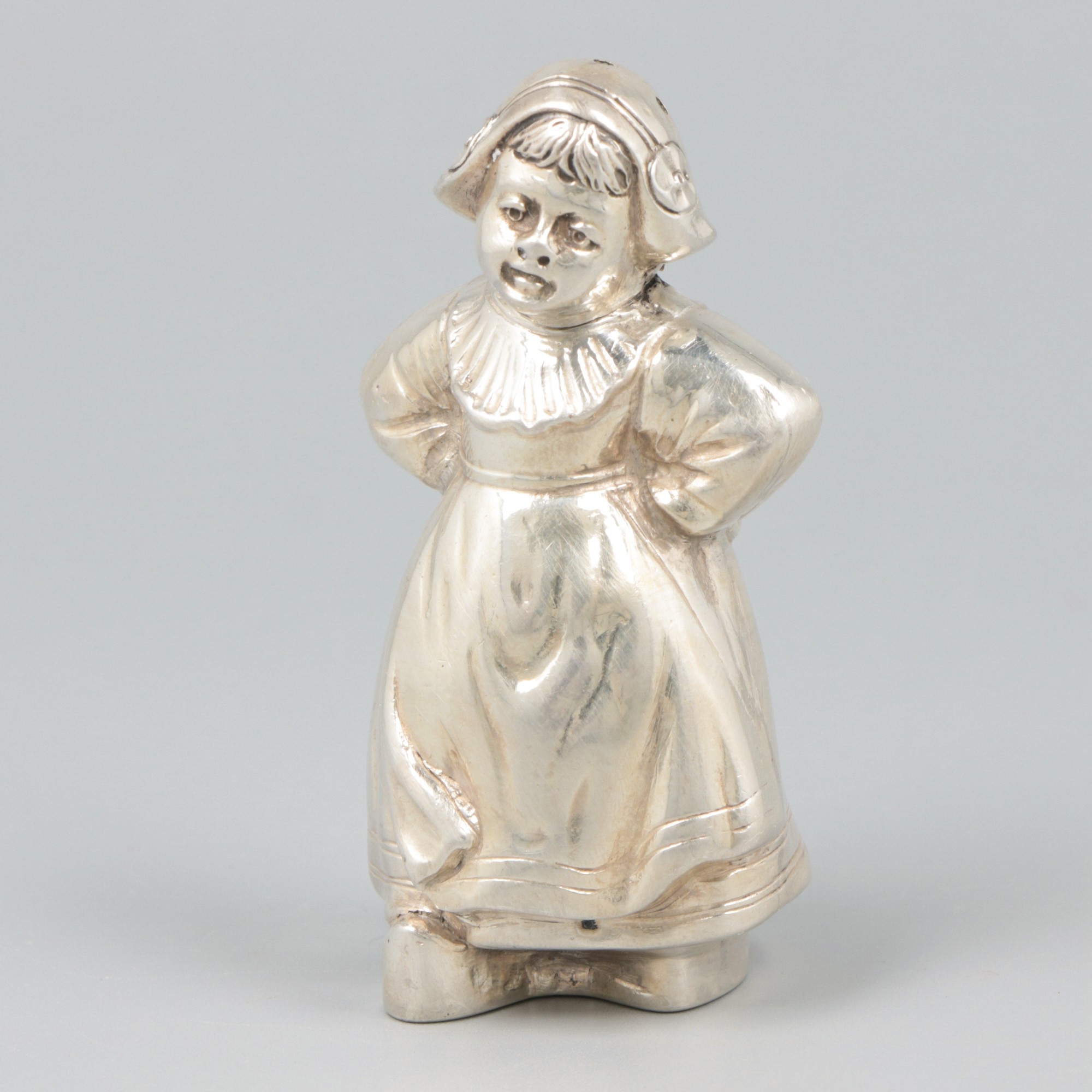 Caster "Dutch girl in traditional costume" silver.