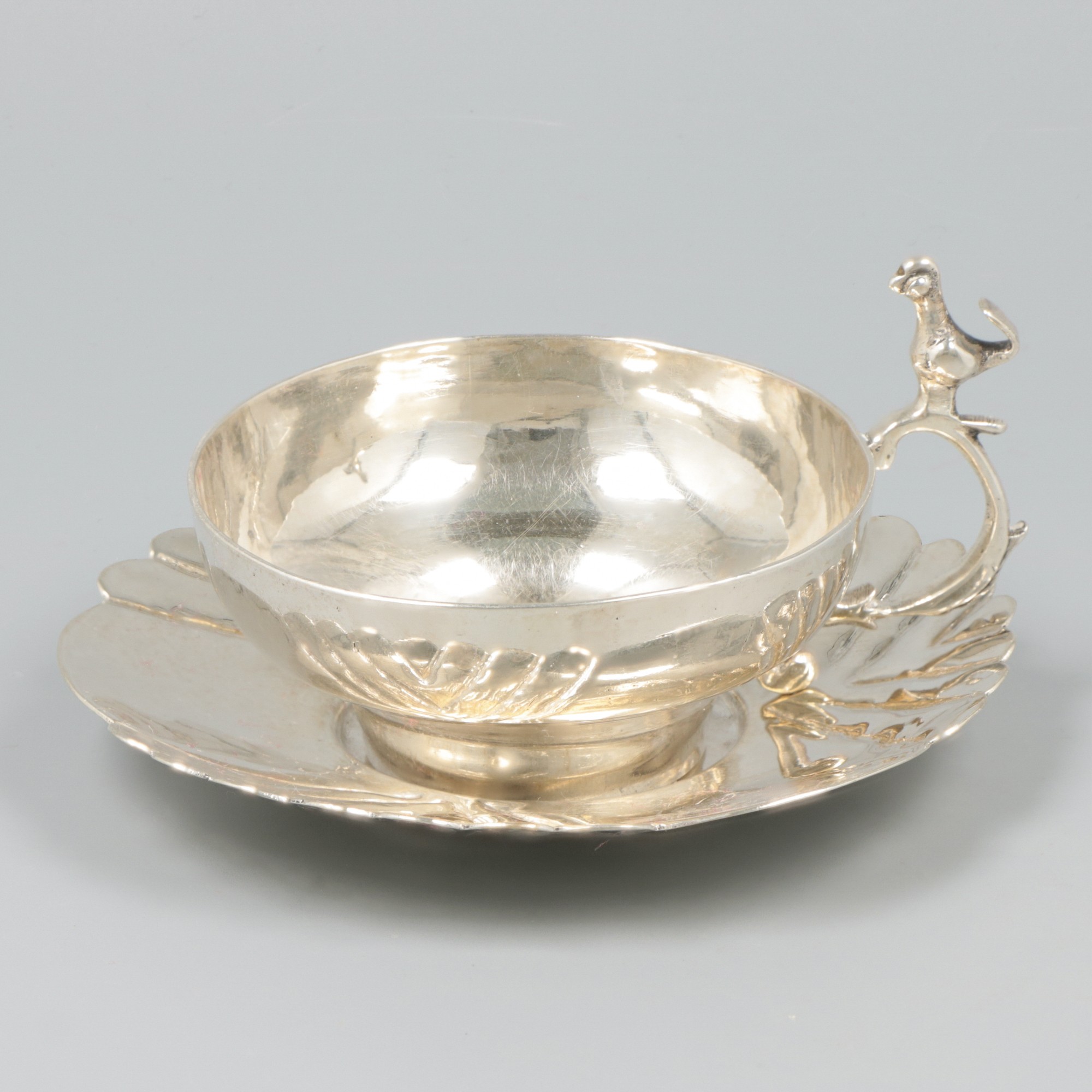 Cup & saucer silver.