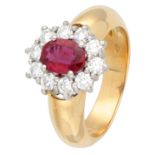 18K Yellow gold entourage ring set with synthetic ruby surrounded by approx. 0.60 ct. diamond.