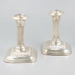 2-piece set of silver candlesticks.