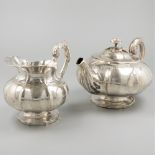 Teapot and milk jug silver.