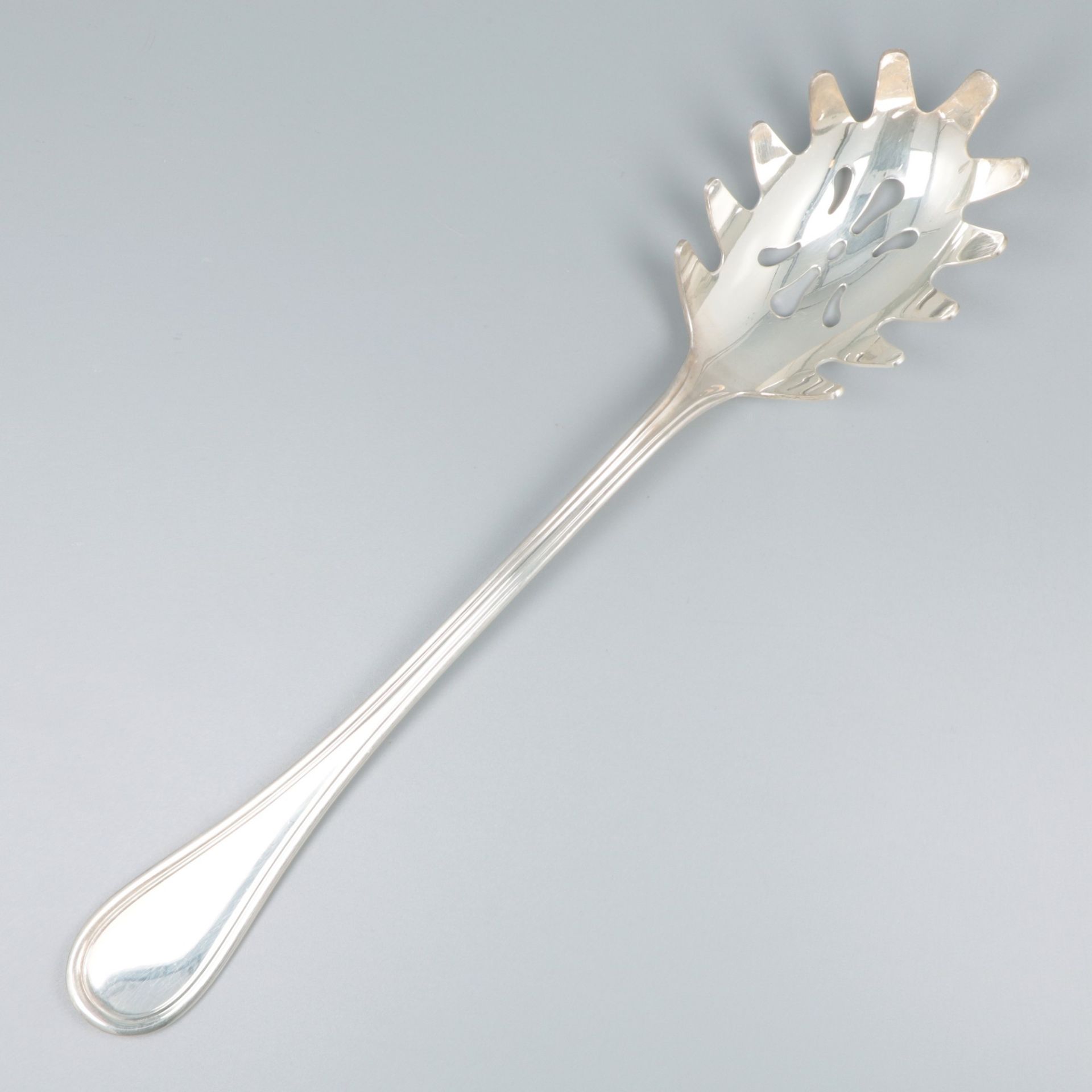 Spaghetti serving spoon silver.