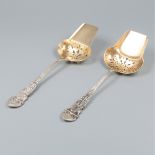 2-piece set of silver serving spoons.