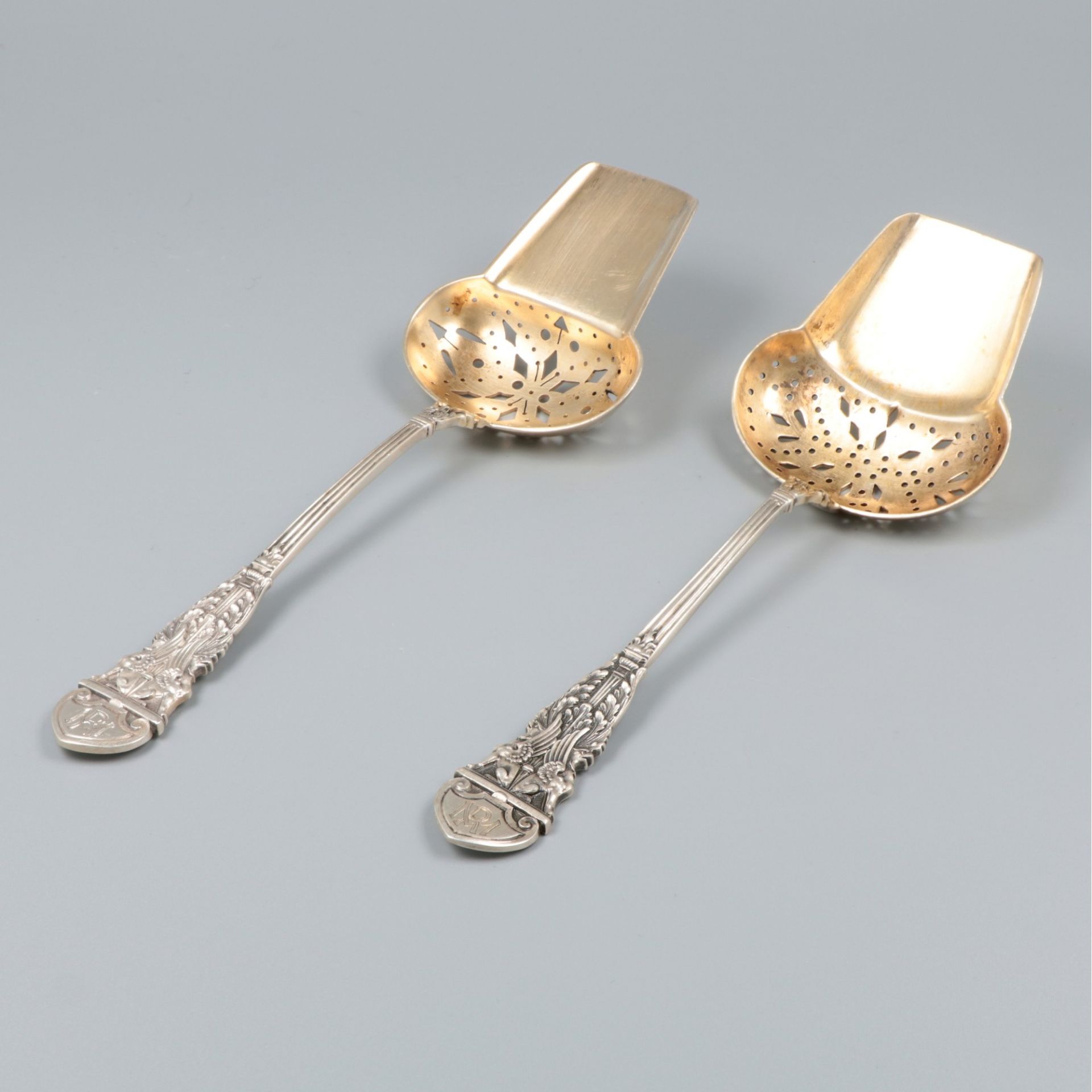 2-piece set of silver serving spoons.