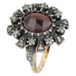 Vintage 14K yellow gold ring set with approx. 3.00 ct. garnet and diamond in silver.