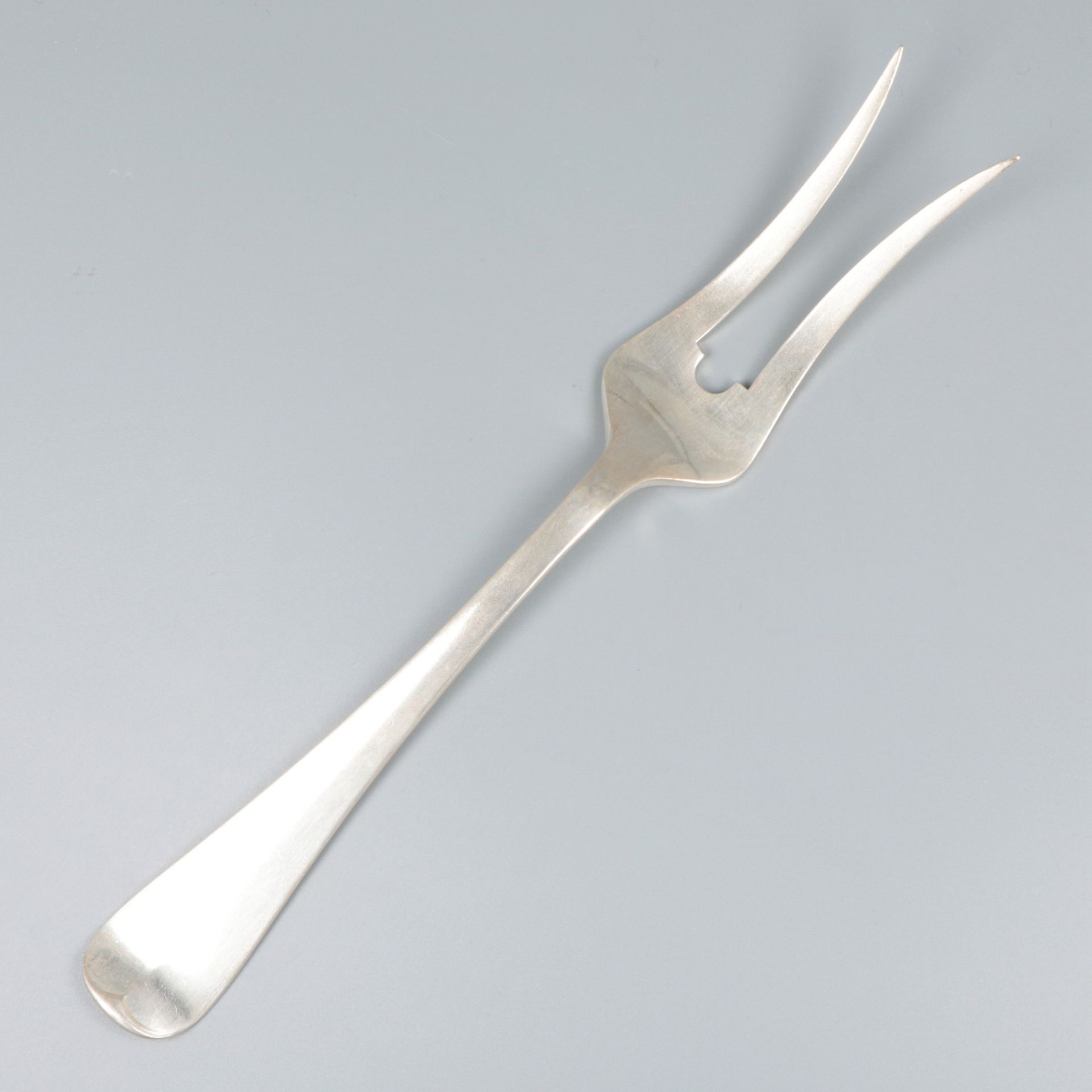 Meat serving fork "Haags Lofje" silver.