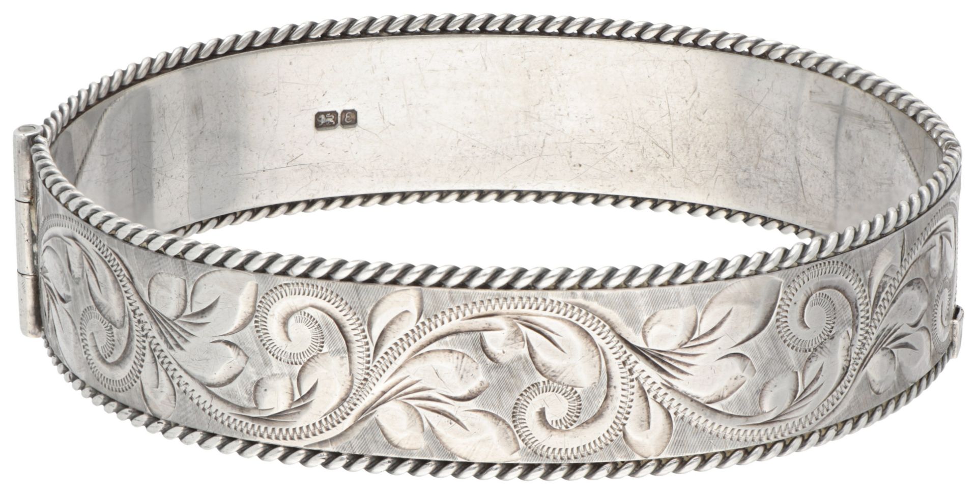 Vintage sterling silver English bangle bracelet with ornate engraved details.