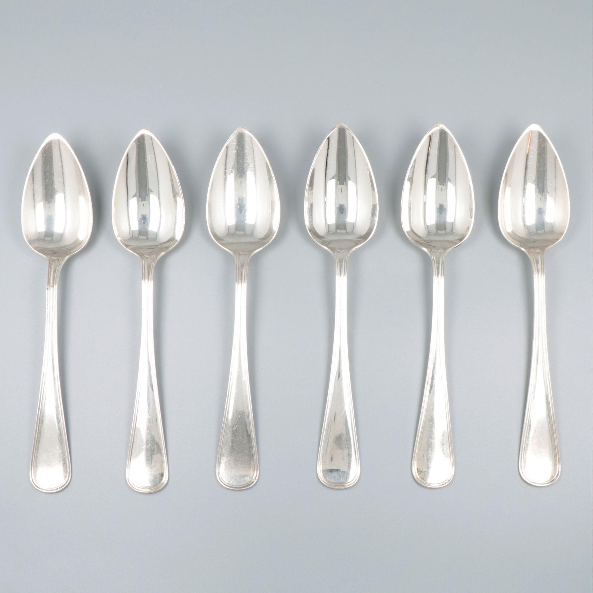 6-piece set of silver dinner spoons.