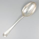 Vegetable serving spoon silver.