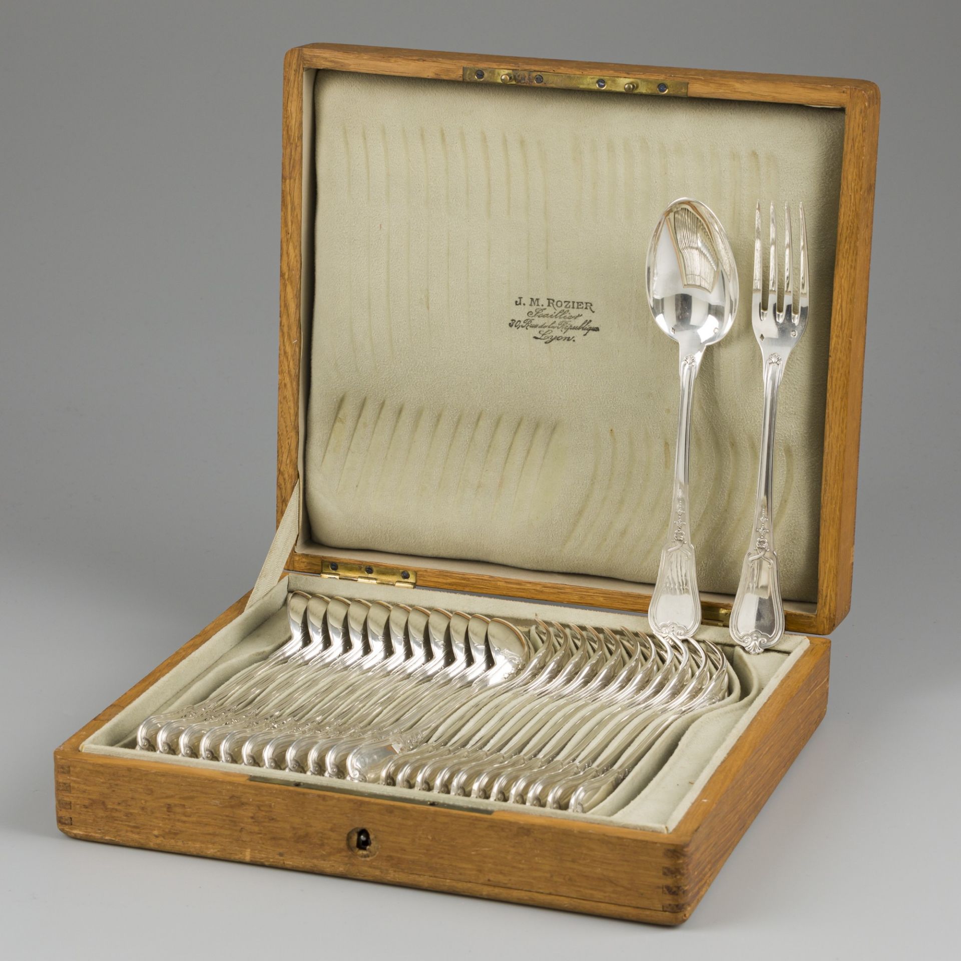 24-piece silver cutlery set.