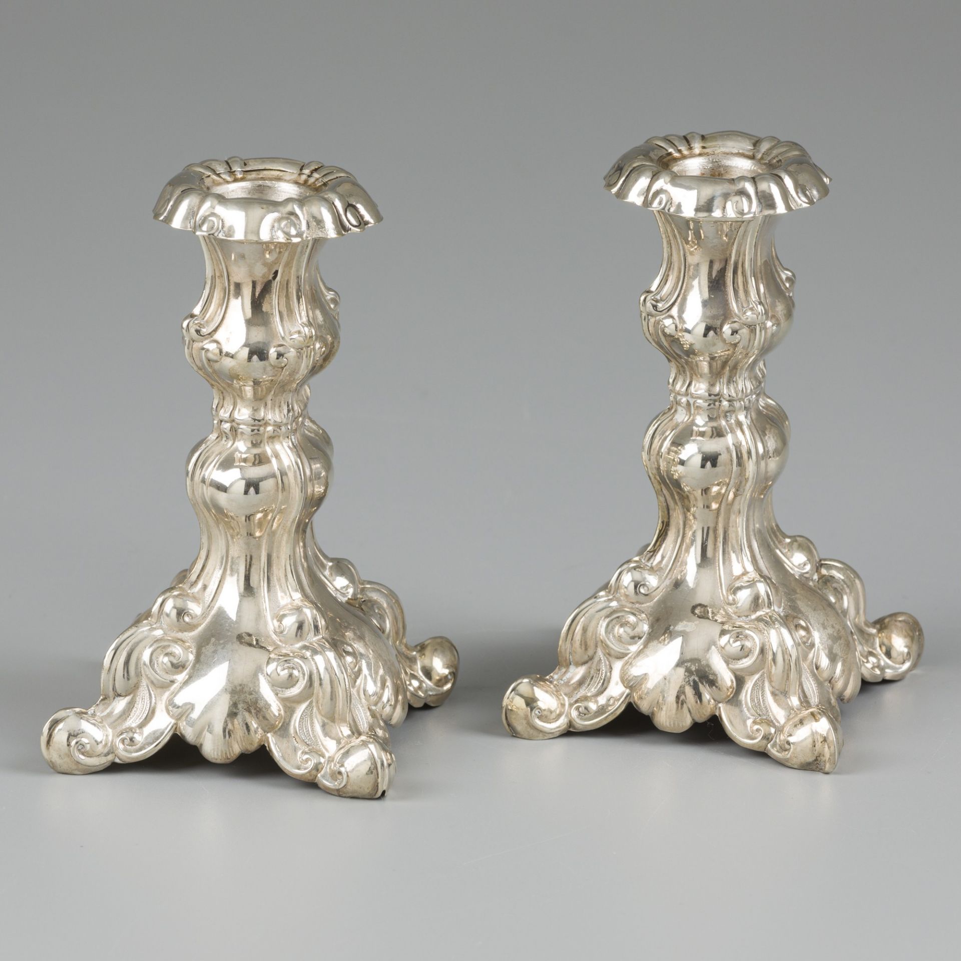 2-piece set of silver candlesticks.