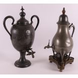 A white pewter pear-shaped tap jug, late 19th century. Resting on a copper/brass triangular brazier,