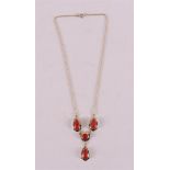 A 14 kt 585/1000 yellow gold necklace, set with cabochon cut red corals, gross weight 10.3 grams,