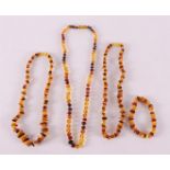Three amber necklaces and a bracelet, tot. 3x.