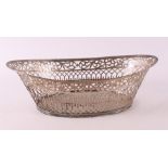 A pierced boat-shaped 2nd content 835/1000 silver bread basket with filet edge, year letter 1924.