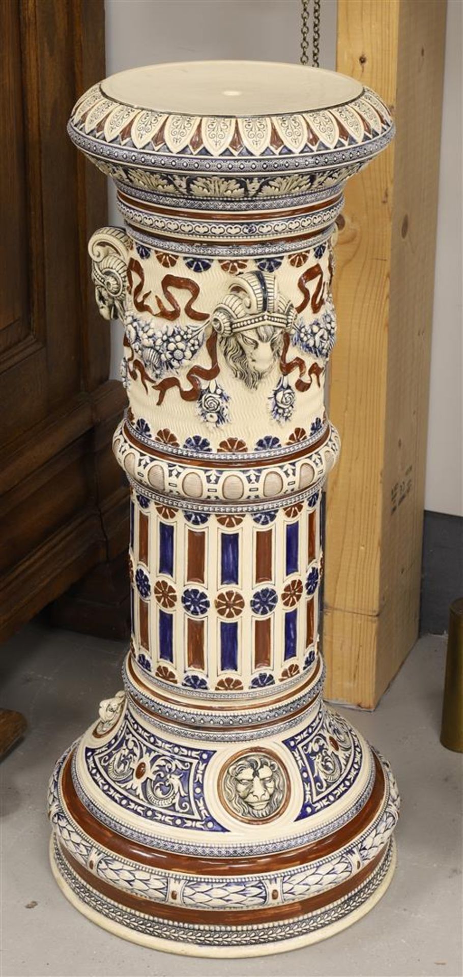 A cylindrical stoneware pedestal, Germany, early 20th century. Decor of ram heads, garlands and - Image 3 of 3