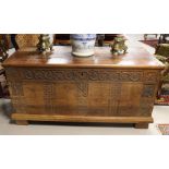 A blanket chest with flat lid, 18th century. Front with letter panels with carved decor of grape