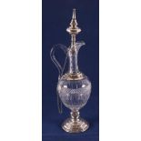 A clear crystal baluster-shaped decanter with second grade 835/1000 silver frame, stopper and