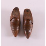 A set of wooden snuff boxes in the shape of clogs, 19th century. With inscription 'W. Pals -