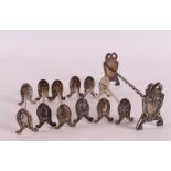 A set of 800/1000 Art Nouveau serving spoon and knife rests, around 1900, to. 7x.