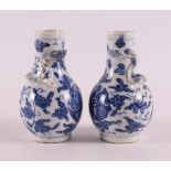 A pair of blue and white porcelain baluster vases with relief of dragons, China, Kangxi, around