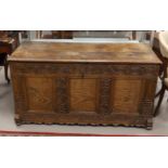 A blanket chest with flat lid, 18th century. Carved decor of panels and carving of, among other