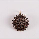 A 14 kt 585/1000 gold pendant, set with garnets, around 1900, gross weight 2.9 grams (1 garnet is