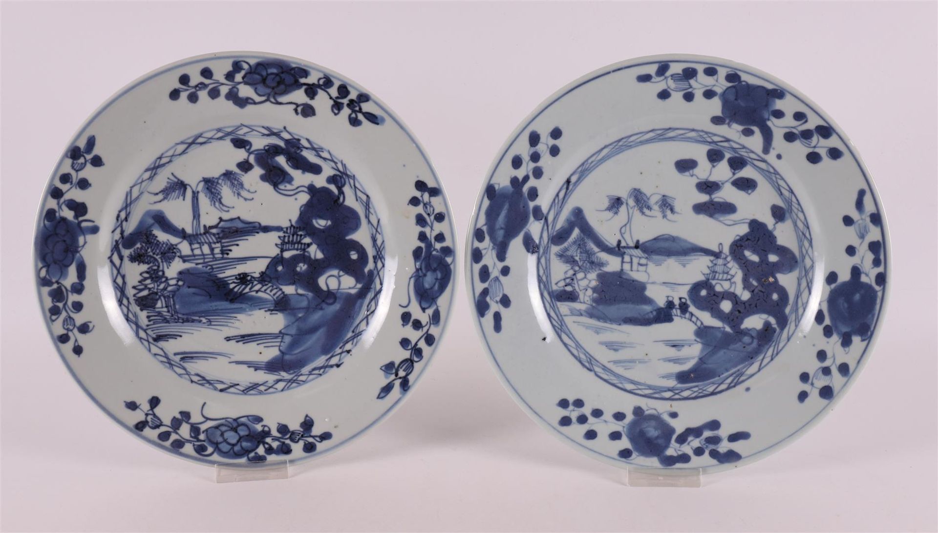 A pair of blue and white porcelain plates, China, Kangxi, circa 1700. Blue underglaze decor of a.