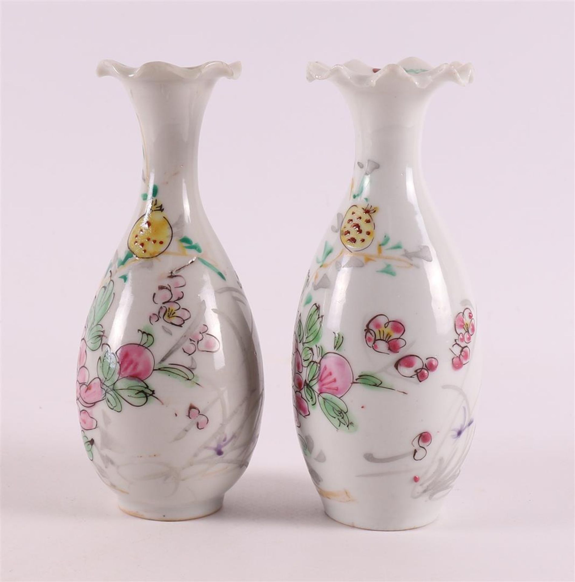 A pair of baluster-shaped vases with a contoured neck, Japan, 19th century. Polychrome floral decor, - Image 2 of 10