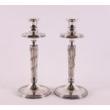 A pair of silver-plated single-light candlesticks, 1st half 20th century. Tulip-shaped cuppa, fluted