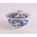 A blue and white porcelain lidded jar, China, 18th century. Blue underglaze decoration of cherry
