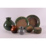 Netherlands, Eskaf. A green glazed earthenware vase, ca. 1930-40, h 20 cm. Hereby two smaller jugs