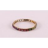 An 18 kt 750/1000 gold tennis bracelet, set with many 'rainbow' sapphires, gross weight 29.8