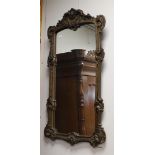 A Louis XV style rectangular mirror, 19th century. Carved floral decor, h 108 x w 57 cm.