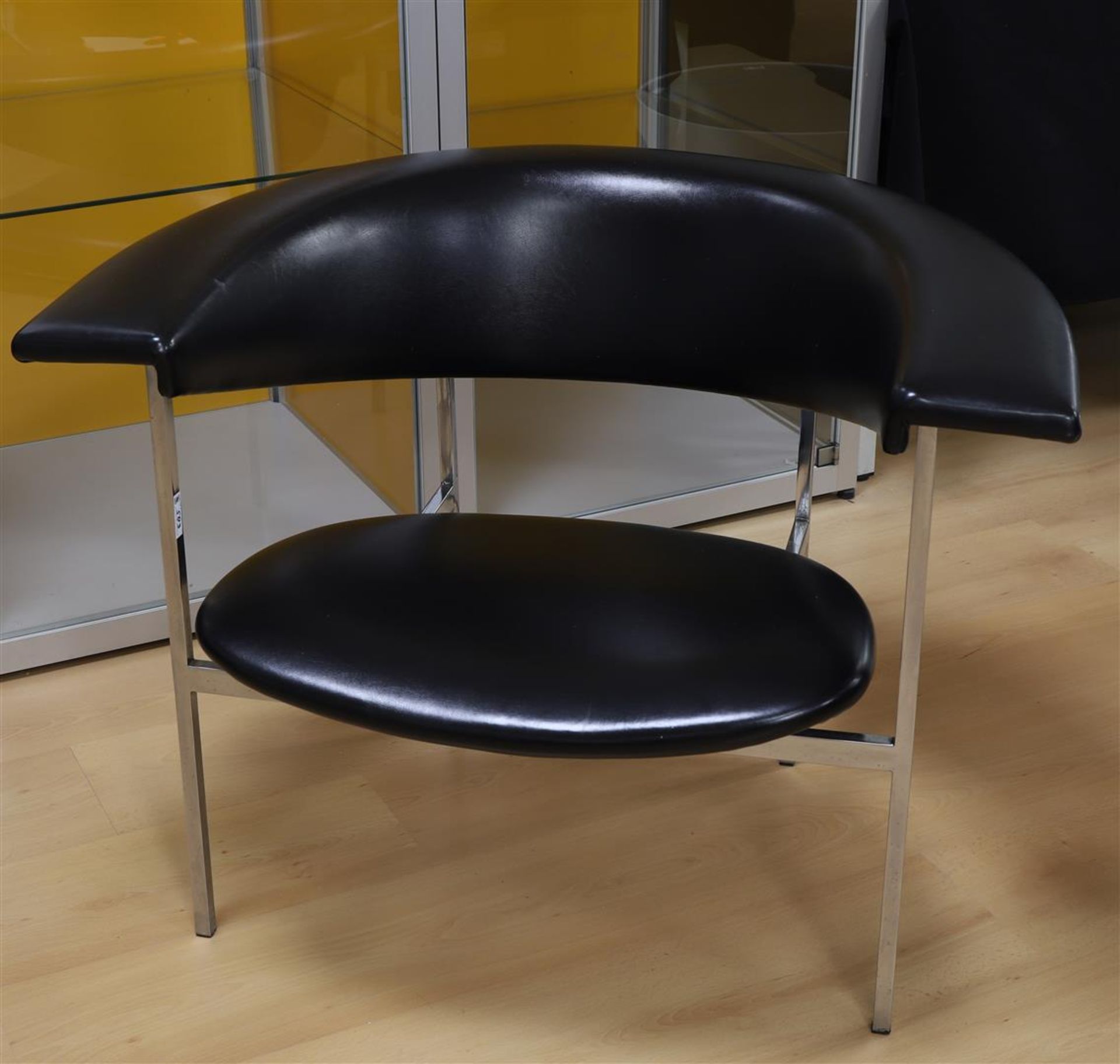 A semi-circular designer armchair 'Meander' with black skai upholstery, design: Rudof Wolf, 1962,