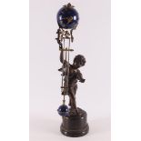 A brown patinated mantel clock in the shape of putti carrying a globe, so-called 'Mysterious',