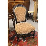 An ebonised knitting chair, Holland, Willem III 19th century. Contoured back window with cutouts and