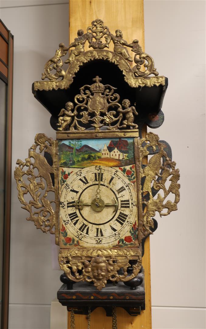 A chair clock, Friesland, 18th century. Polychrome decorated wooden chair. The hood and the attic