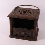 A square oak stove with brass handle, anno 1870. Turkish knot on the lid and on the front 'Maria